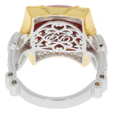 Detailed view of an Oval Red Coral Sterling Silver Ring with intricate filigree design and gold accents.